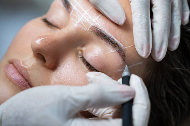 istock Woman during professional eyebrow mapping procedure 1363682873