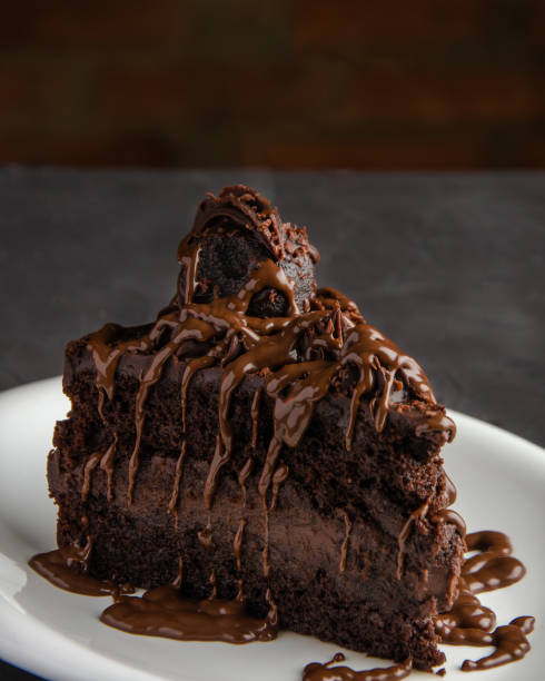 istock Piece of chocolate cake with chocolate syrup 1363683250