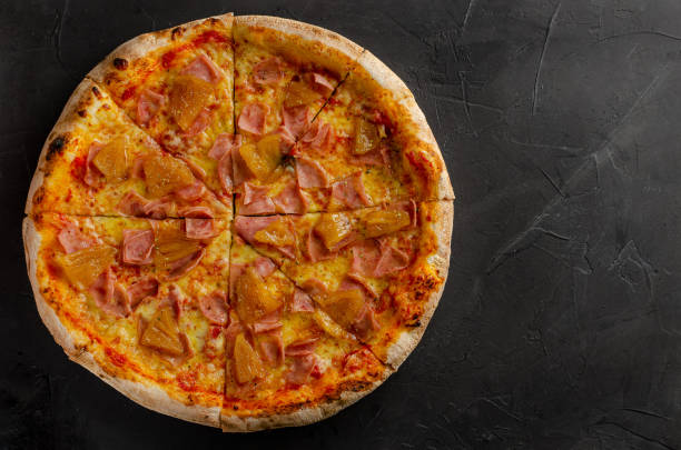 istock Hawaiian pizza prepared in a wood-fired oven. 1363684834