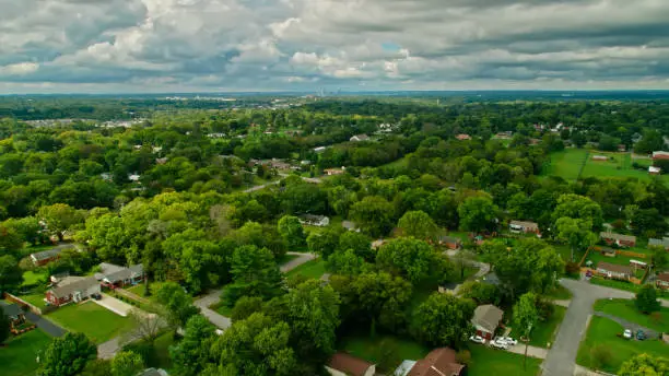Photo of Drone Shot of Suburban Homes with Nashville Skyline in Distance