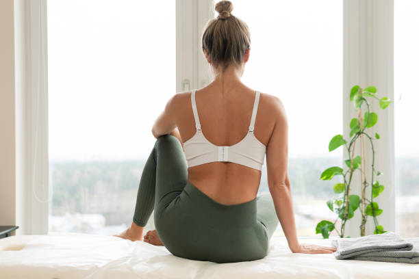 istock Woman relaxing after physical therapy or massage session 1363686829
