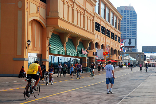 Atlantic City NJ USA August 16 Folks enjoy a summer day walking and biking on the boardwalk in Atlantic City, New Jersey , passing the casinos on a summer day
