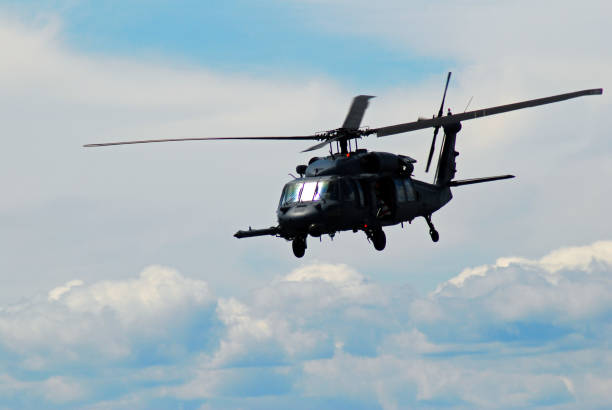 Wantagh, NY, USA May 23 A military Blackhawk chopper flies by the clouds in the sky above Wantagh, New York