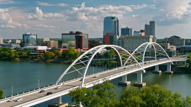 Aerial shot of the Broadway Bridge across the Arkansas River and the skyline of downtown Little Rock, Arkansas on a Fall afternoon.   \n\nAuthorization was obtained from the FAA for this operation in restricted airspace.