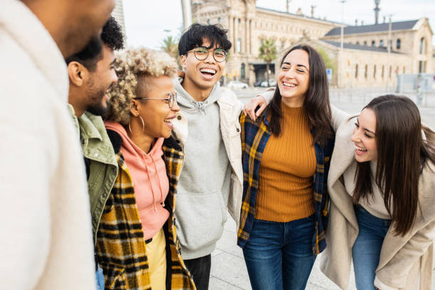 istock Group of multi ethnic young people having fun outdoors 1363693011