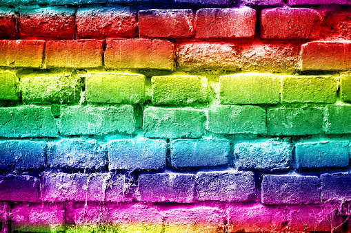 Abstract rainbow colors brick wall background view, red, yellow, green, blue