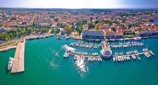 Historic town of Pula waterfront aerial panoramic view Historic town of Pula waterfront aerial panoramic view, Istria peninsula in Croatia croatia stock pictures, royalty-free photos & images