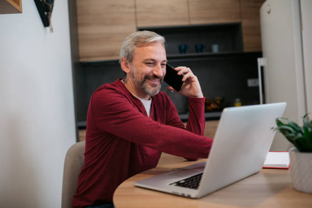 istock Middle aged Caucasian male freelancer working from home 1363696832