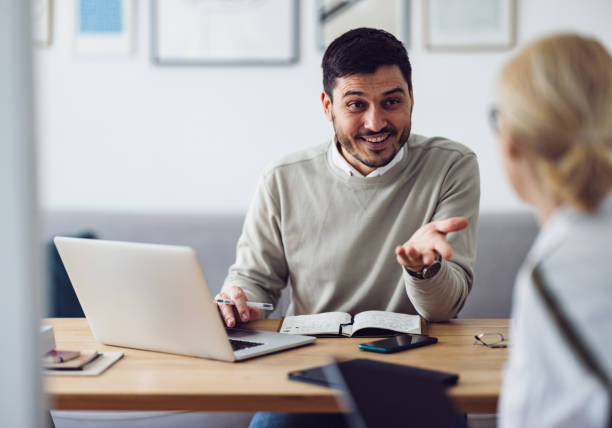 istock Home Office: Man and Woman Having a Meeting 1363697825