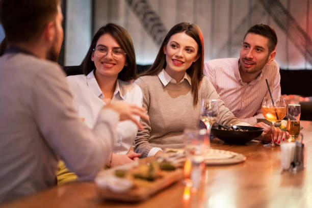istock Friends having a good time in a restaurant 1363698676