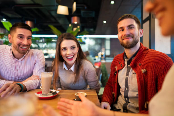 istock Young friends having a great time in cafe 1363698752