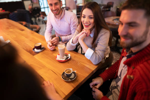 istock High-angle view of a friends in cafe 1363698768