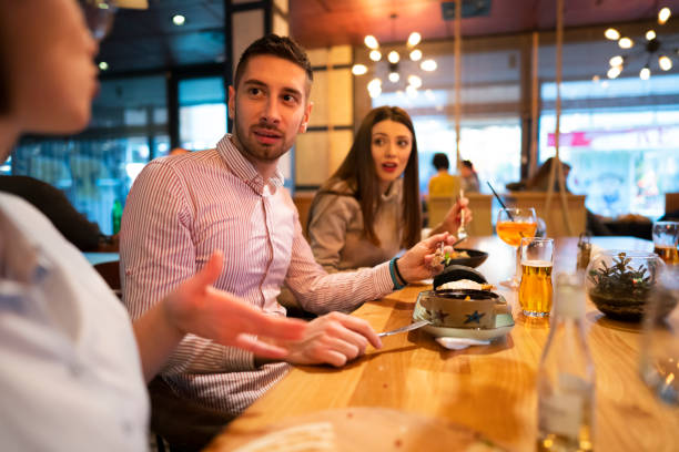 istock Young couple having lunch friends 1363698786