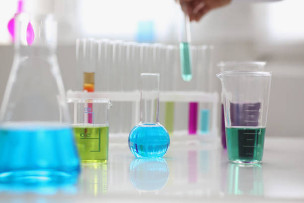 istock Working mess, lab tubes stand on table in laboratory of liquid testing 1363699026