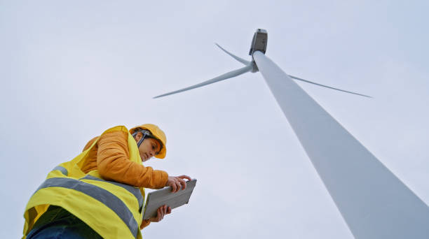 istock Female wind energy engineer working in wind farm. Renewable Energy Systems. Carbon neutrality and sustainable energy. 1363699128