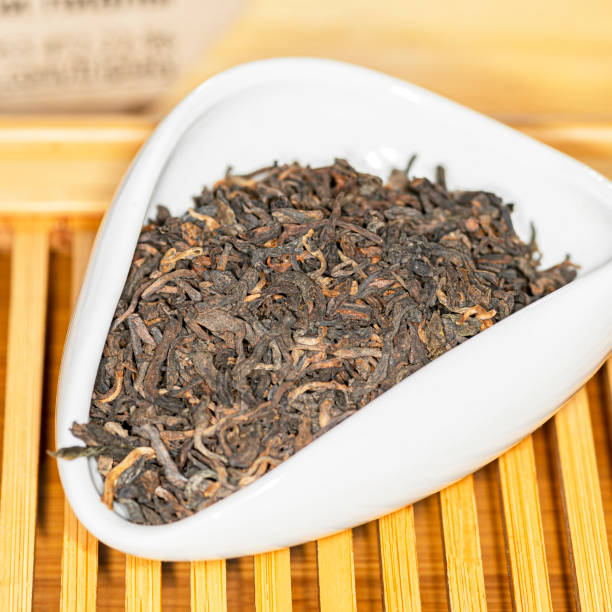 istock Chinese bulk extruded tea ripe Puer in tea presentation vessel 1363699740