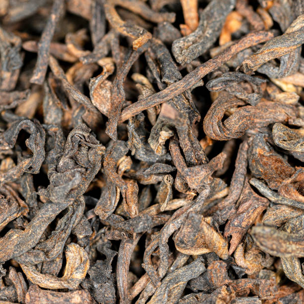 istock Chinese bulk extruded tea ripe puer, macro 1363700794