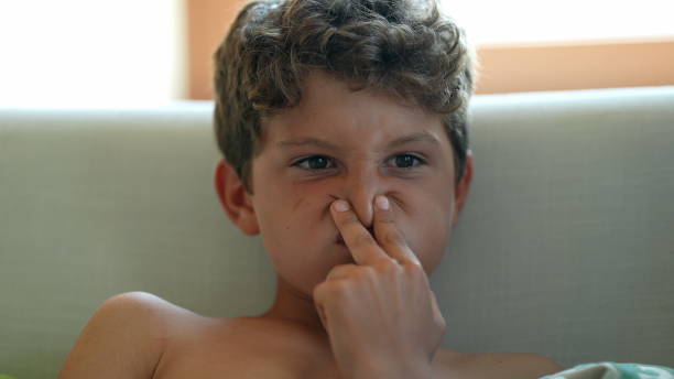istock Child grimacing, kid funny face grimace close-up boy face 1363703986