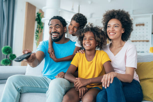 istock Family watching television 1363706393