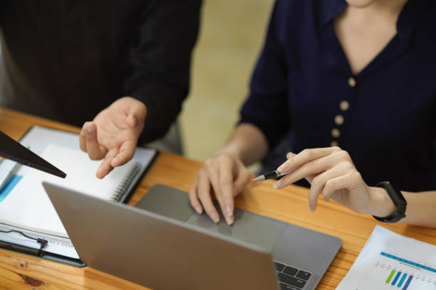 istock Two of colleagues worker doing their project together at the office. 1363717650