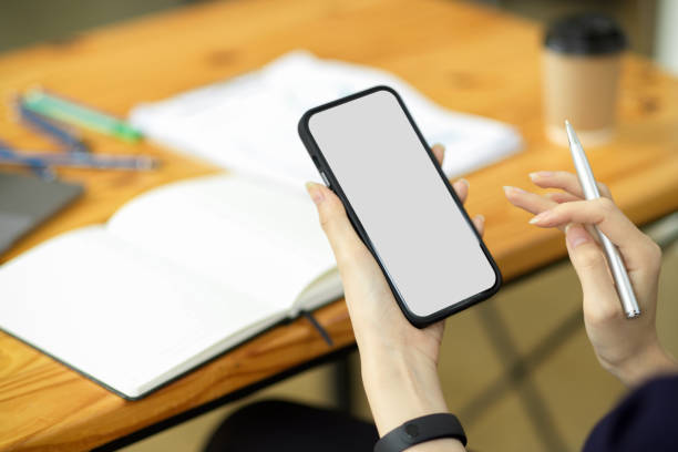 istock Female's hands holding, using modern smartphone 1363717693