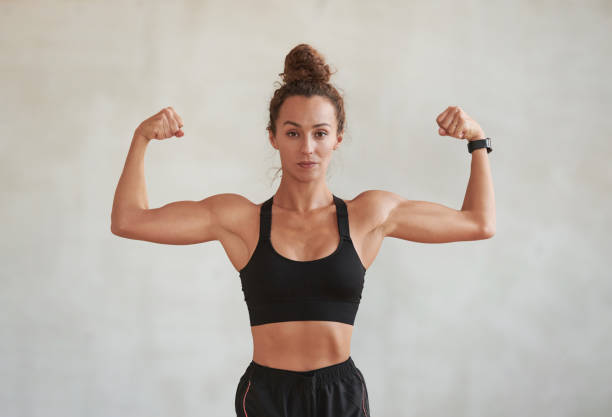 istock Woman Demonstrating Muscles 1363718568