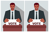 The man (voter) in suit casts a vote into the ballot box at the polling place during elections with two different emotions