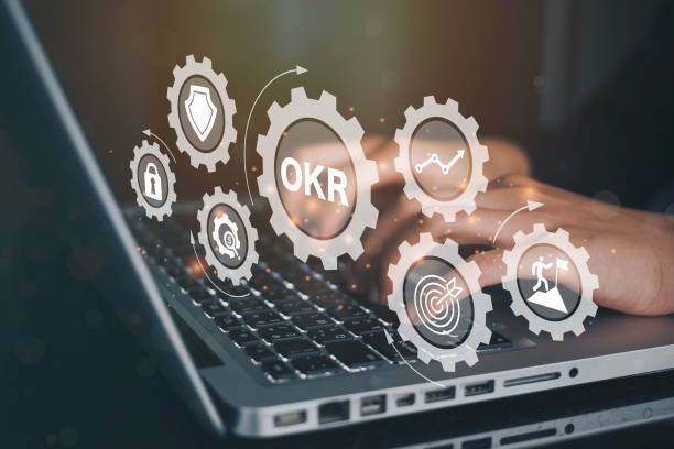 istock Businessmen using a computer to OKR (objective key result)banner web icon for business, target, focus and quarter. 1363723398
