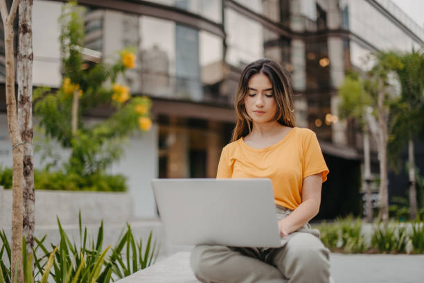 istock young woman working outside the office 1363723507