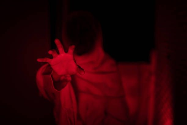 istock Scary ghost in white dress halloween theme red tone 1363723518