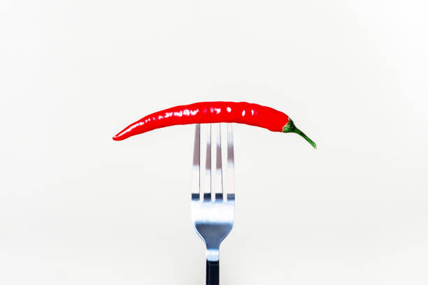 istock Red hot chili peppers strung on a fork 1363726015