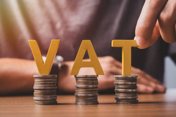 vat concept. word vat with stacked coins and the hands are word vat into the jar to accumulate money for paying vat. - coin cheap jar currency imagens e fotografias de stock