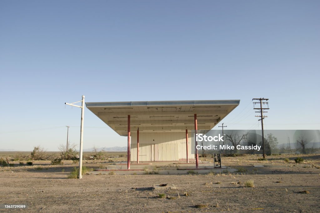 Abandoned Gas Station Abandoned gas station on Route 66 at sunset. Gas Station Stock Photo