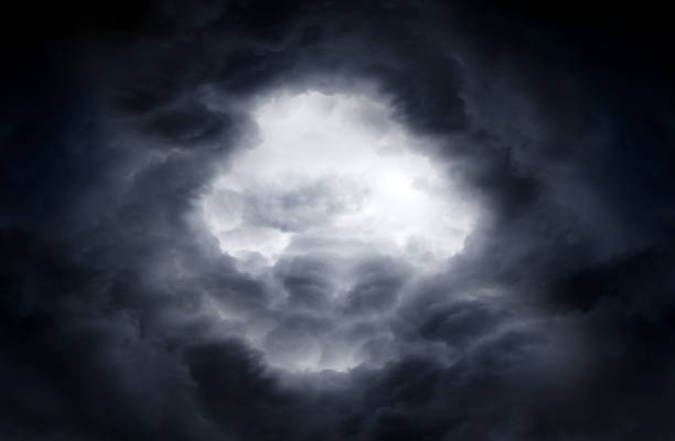 Hole in the Dramatic Clouds Hole of the Sky in the Dark Storm Clouds gloriole stock pictures, royalty-free photos & images