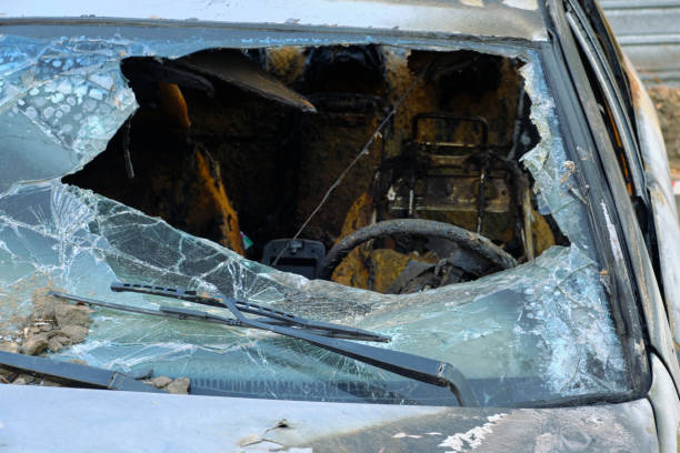 istock Broken and melted windshield of burnt out car after fire. 1363731042