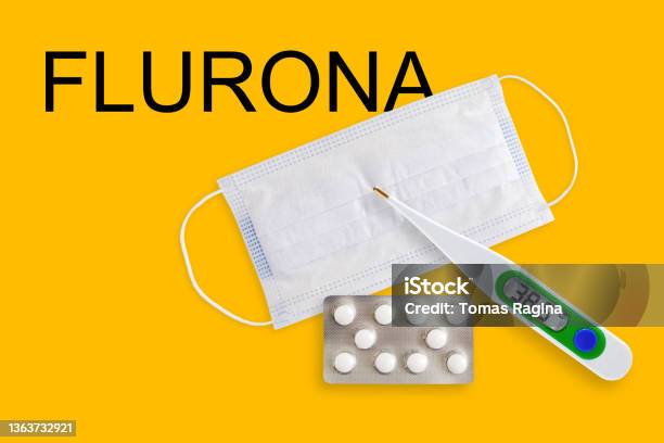 Covid 21121face Masks Thermometer And Pills Isolated On A Yellow Background Covid 19 Alpha Beta Gamma Delta Lambda Mu Omicron Variants Outbreak Around The World8 1 Stock Photo - Download Image Now