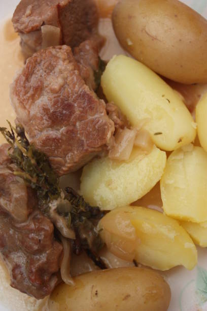 istock Veal with onions served with boiled potatoes 1363733077
