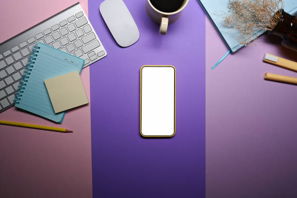 istock Smart phone, coffee cup and stationery on purple background. 1363733229
