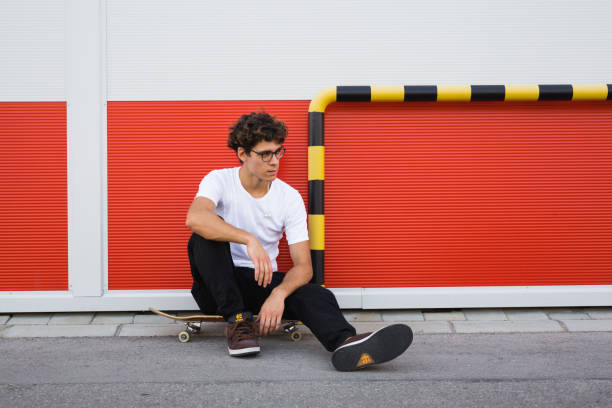 istock young man driving his skateboard 1363735016