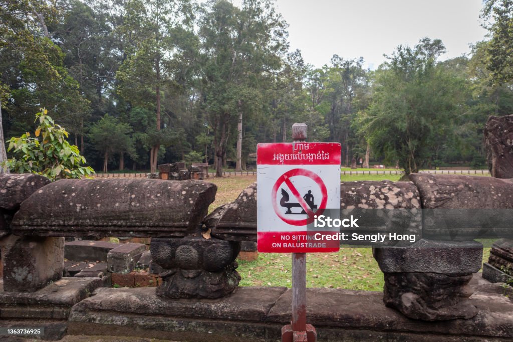 The Sign The no sitting sign of Khmer temple. Angkor Stock Photo