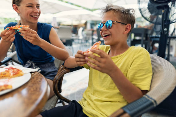 istock Family enjoying pizza for lunch 1363737777