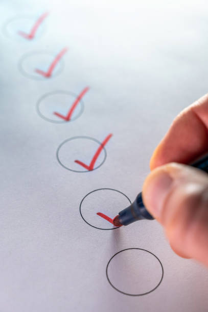 istock Checking off a list as a symbol of structured action 1363738477