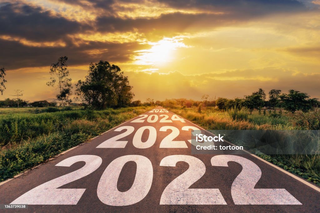 New Year 2022 Goals Concept : Empty asphalt road sunrise with text go to New year 2022 2023 Stock Photo