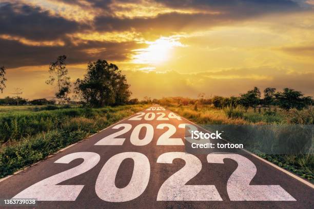 New Year 2022 Goals Concept Empty Asphalt Road Sunrise With Text Go To New Year 2022 Stock Photo - Download Image Now