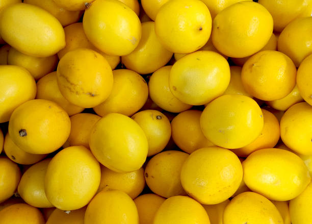 istock Lemons top view, yellow smooth lemons, box with lemons 1363741129