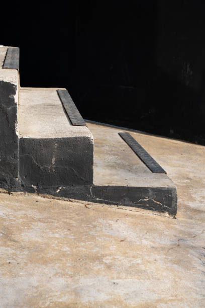 istock Gray concrete stairs and black wall. simple minimal 1363742204