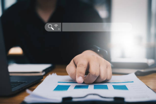 istock Businessman analyst financial advisor preparing statistical report searching documents on work desk, browsing information online by laptop computer. 1363745439