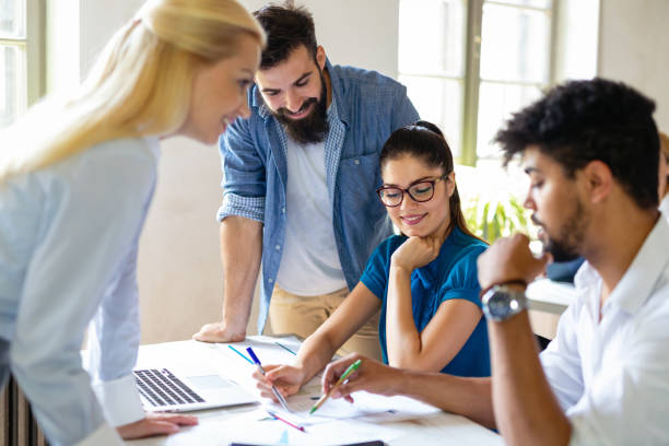 istock Group of multiethnic business people cooperating during business training 1363745793