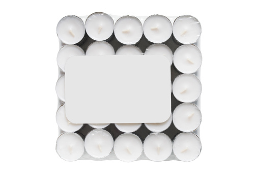 Pack of white tealight candles isolated over white