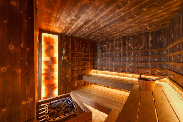 istock Empty wooden steam room with stone heater 1363747378